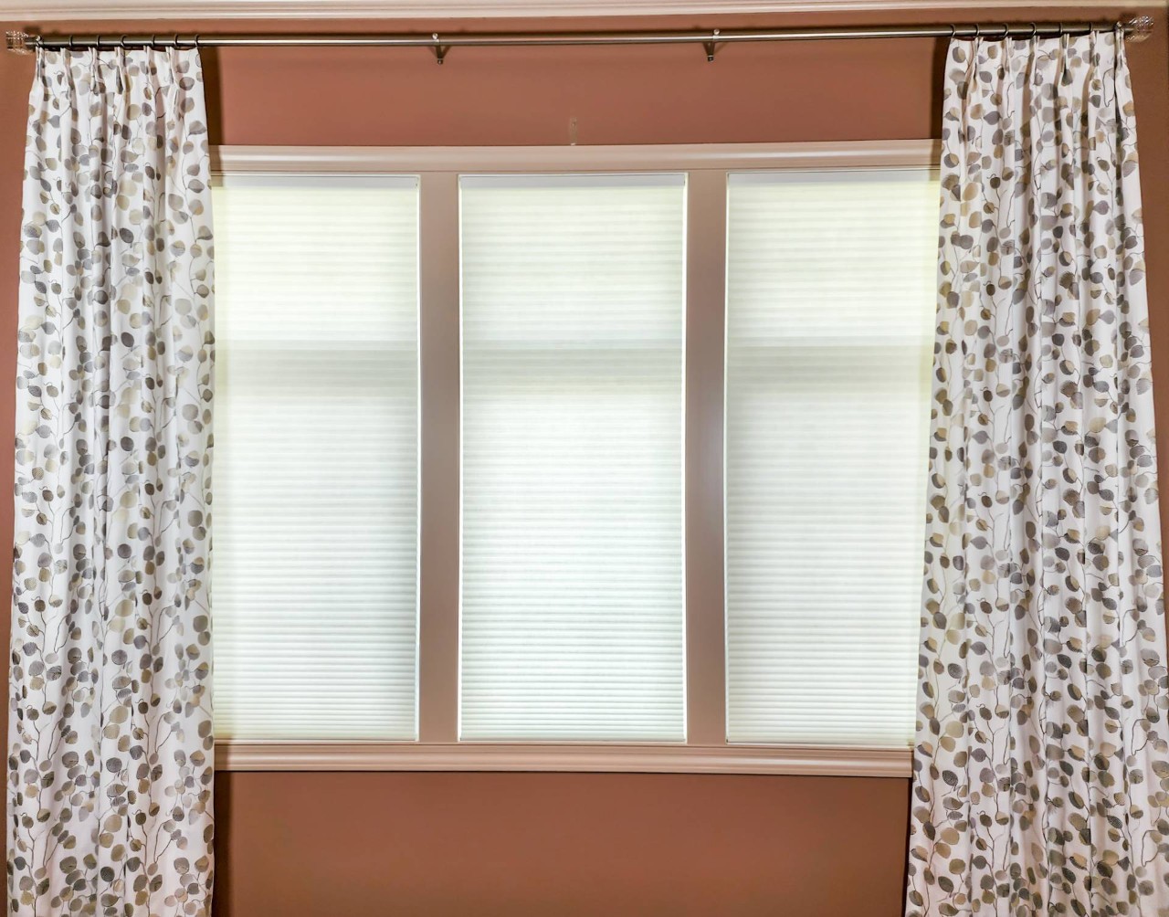  Carole Fabrics™ Drapery Panels paired with a Hunter Douglas Duette® Cellular Shade at Captivating Windows by Magnolias near Norfolk, Nebraska (NE)